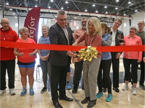 Carefor CEO Steve Perry, left, and Jennifer Brenning, Carleton's director of recreation and athletics, cut the ribbon for the official launch of The Club on Tuesday.