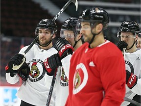 Christian Wolanin, left, of the Ottawa Senators during morning practice at the Canadian Tire Centre on Thursday, Jan. 30, 2020.