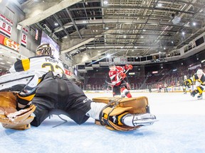 Jack Quinn, middle, scores the second of his three goals for the 67's during Thursday's game against the Frontenacs. It restored Ottawa's two-goal lead in the third period.