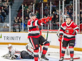 Jack Quinn pointing out Beck's primary assist on Quinn's hat trick goal.