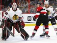 Brady Tkachuk battles Slater Koekkoek in front of Robin Lehner during the first period as the Ottawa Senators take on the Chicago Black Hawks in NHL action at the Canadian Tire Centre in Ottawa. Photo by Wayne Cuddington / Postmedia