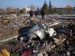 Rescue teams work amidst debris after a Ukrainian plane carrying 176 passengers crashed near Imam Khomeini airport in the Iranian capital Tehran early in the morning on Jan. 8, 2020, killing everyone on board. (AFP via Getty Images)