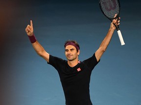 Switzerland's Roger Federer celebrates after victory against Australia's John Millman during their men's singles match on day five of the Australian Open tennis tournament in Melbourne on Jan. 24, 2020. (WILLIAM WEST/AFP via Getty Images)