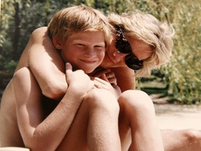 An undated handout picture released on July 22, 2017 by Kensington Palace from the personal photo album of the late Diana, Princess of Wales shows her embracing Prince Harry while on holiday at an undisclosed location. / AFP PHOTO / KENSINGTON PALACE / The Duke of Cambridge and Prince / RESTRICTED TO EDITORIAL USE - NO USE ON THE FRONT COVERS OF ANY UK OR INTERNATIONAL MAGAZINES - MANDATORY CREDIT "AFP PHOTO / DUKE OF CAMBRIDGE AND PRINCE HARRY / KENSINGTON PALACE" - NO MARKETING NO ADVERTISING CAMPAIGNS - DISTRIBUTED AS A SERVICE TO CLIENTS - NO ARCHIVES - NO SALES - NO USE AFTER JULY 31, 2017 / THE DUKE OF CAMBRIDGE AND PRINCE/AFP/Getty Images