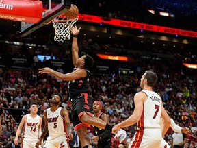 Raptors guard Kyle Lowry shoots a layup against the Heat during the first half of Thursday's game in Miami.
