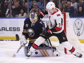 Sabres goalie Linus Ullmark makes a save on Senators’ Brady Tkachuk during the second period on Tuesday night in Buffalo. (THE ASSOCIATED PRESS)