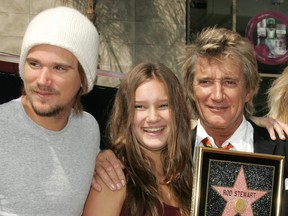 In this Oct. 11, 2005 file photo, singer Rod Stewart, right, is pictured with his children Sean, left, and Renee at a ceremony honouring Stewart with a star on the Hollywood Walk of Fame in Hollywood, California. (Vince Bucci/Getty Images)