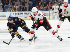 Sabres winger Michael Frolik attempts to block a pass by the Senators' Tyler Ennis during the first period of play on Tuesday, Jan. 28. 2020.