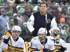 Nashville Predators head coach Peter Laviolette stands behind the bench during the 2020 Winter Classic hockey game against the Dallas Stars at Cotton Bowl Stadium.