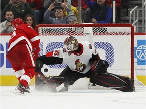 Detroit Red Wing Dylan Larkin scores a shootout goal on Ottawa Senators goaltender Marcus Hogberg at Little Caesars Arena.