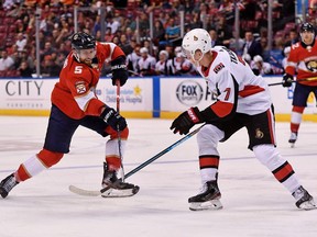 Senators winger Brady Tkachuk defends against Panthers defenceman Aaron Ekblad in a game at Sunrise, Fla., on Dec. 16.