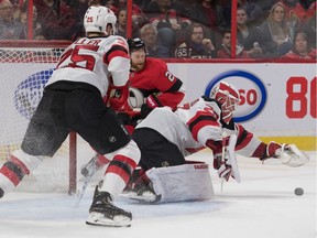 Senators let it slip away, Devils win in OT