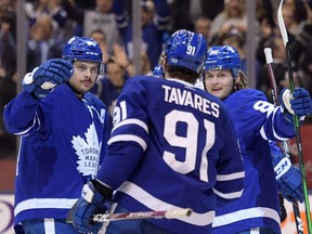 Toronto Maple Leafs forward William Nylander celebrates scoring against Calgary Flames with forwards John Tavares and Auston Matthews in the third period at Scotiabank Arena.