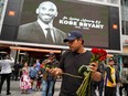 A fans mourns the death of retired NBA star Kobe Bryant outside the Staples Center prior to the 62nd Annual Grammy Awards on Jan. 26, 2020 in Los Angeles.