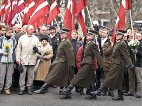 Former veterans of the Latvian Legion, a force that was part of the Nazi German Waffen SS during the Second World War, and their relatives look at an honour guard walking to the Monument of Freedom as part of an annual commemoration of a key 1944 battle in their ultimately failed attempt to stem a Soviet advance. Jewish groups, Moscow and some in Latvia's ethnic-Russian community see the parade as glorifying Nazism.