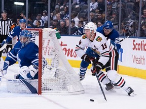 Chicago Blackhawks centre Jonathan Toews battles for a puck against Toronto Maple Leafs defenceman Martin Marincin behind Toronto goaltender Frederik Andersen during the second period at Scotiabank Arena in Toronto on Saturday, Jan. 18, 2020.