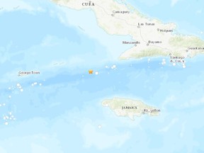 The U.S. Geological Survey says an earthquake of magnitude 7.7 struck south of Cuba on Tuesday, triggering a tsunami waves warning for Cuba, Jamaica and the Cayman Islands.