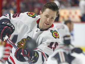 Forward Zack Smith warms up prior to the start of Tuesday night’s game in Ottawa. Smith, who played 612 regular-season games with the Senators, was making his return to the city as a member of the Chicago Blackhawks.