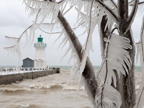 In this Jan. 13, 2012 file photo, icicles hang from trees next to the lighthouse and pier on Lake Erie, in Port Dover, Ont. THE CANADIAN PRESS/Dave Chidley