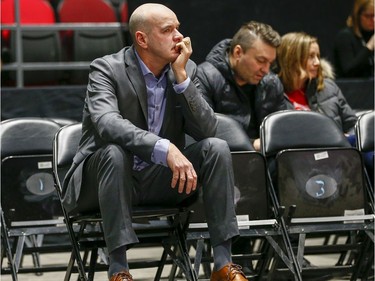 Dave Smart looks on from the seats in the women's Capital Hoops Classic basketball game between the University of Ottawa and Carleton University.