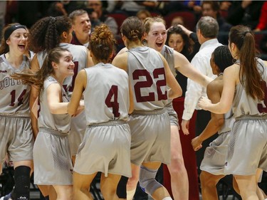 The Gee Gee's celebrate the win in the women's Capital Hoops Classic basketball game between the University of Ottawa and Carleton University.