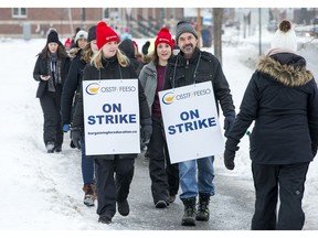 Teachers and education workers picket at Longfields-Davidson Heights Secondary school during a one-day strike by OSSTF in January. Photo by Wayne Cuddington / Postmedia