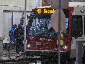 Transit passengers board a bus at St Laurent station after an LRT was left stranded on the track slightly east of the St Laurent station due to a malfunction
