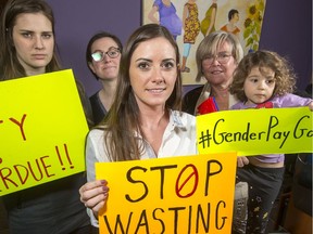 Christi Baker (C) with her fellow midwives (from left) Nicole Pichette, Libby Ormond and Sharon Dean holding Clara Godin, 4,