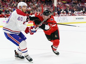 Brady Tkachuk of the Ottawa Senators shoves Joel Armia of the Montreal Canadiens in the second period at Canadian Tire Centre on Saturday.