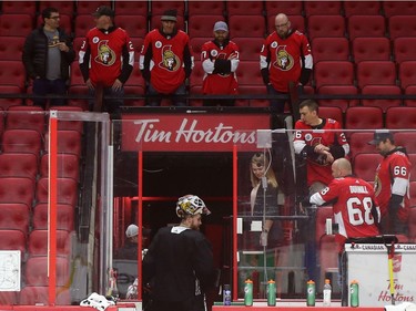 Participants of the Soldier On event at the Canadian Tire Centre look at Marcus Högberg exiting the ice in Ottawa, February 03, 2020.  In partnership with the Canadian Forces' Soldier On Program, the Senators Alumni will host a two-day camp at Canadian Tire Centre in support of ill and injured veterans beginning Monday morning. On Monday, Feb. 3, a group of ill and injured veterans from the Canadian Forces (CF) Soldier On Program will arrive at Canadian Tire Centre for a two-day camp with the Senators Alumni.  Photo by Jean Levac/Postmedia News assignment 133187