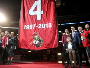 Chris Phillips and his family watch his jersey being lifted to the rafters on Tuesday night.