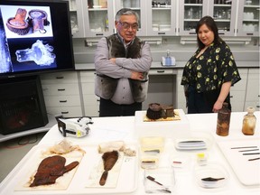 Stanley Anablak, President of Kitikmeot Iniut Association and Pamela Gross, President of Inuit Heritage, Trust look at recovered artifacts from the Franklin Expedition were shown at a press conference in Ottawa, February 20, 2020. Photo by Jean Levac/Postmedia News assignment 133280