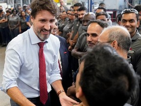 Prime Minister Justin Trudeau greets workers as he visits auto parts company ABC Technologies in Brampton on Jan. 30, 2020. (Reuters)