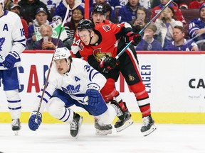 Ottawa Senators' Brady Tkachuk checks Leafs forward Auston Matthews during Saturday's game. (GETTY IMAGES)