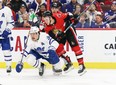 Ottawa Senators' Brady Tkachuk checks Leafs forward Auston Matthews during Saturday's game. (GETTY IMAGES)