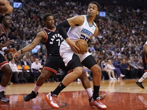Charlotte Hornets forward PJ Washington, right, drives to the net against Toronto Raptors guard Kyle Lowry during the first half at Scotiabank Arena, Feb. 28, 2020. (John E. Sokolowski-USA TODAY Sports)