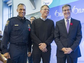 Chief Peter Sloly, (from left), Acting Chair L. A. (Sandy) Smallwood and Mayor Jim Watson gather for a photo at the Ottawa Police Services Board at Ottawa City Hall. Watson was swarn in as a member of the board.