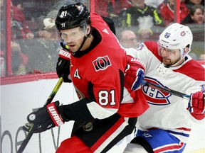 Ottawa Senators' Ron Hainsey gets ahead of Tomas Tatar behind Ottawa's net during  their matchup Saturday (Jan. 11, 2020) at the Canadian Tire Centre in Ottawa.