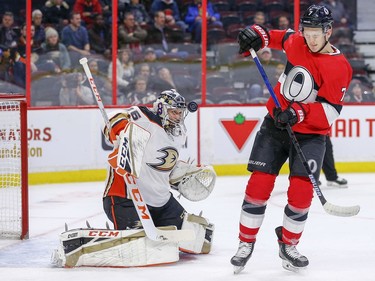 Brady Tkachuk (left) tips the puck towards goalie John Gibson in the first period as the Ottawa Senators take on the Anaheim Ducks in NHL action at the Canadian Tire Centre in Ottawa.