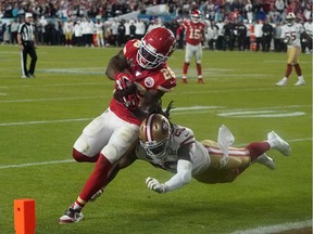 Cornerback for the San Francisco 49ers Richard Sherman fails to stop Running back for the Kansas City Chiefs Damien Williams (26) from scoring a touchdown during Super Bowl LIV between the Kansas City Chiefs and the San Francisco 49ers at Hard Rock Stadium in Miami Gardens, Florida, on Sunday.