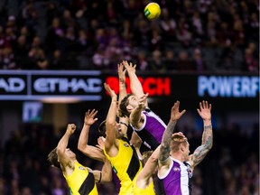 Richmond and St. Kilda players vie for the ball during a 2017 Australian Football League match in Melbourne.
