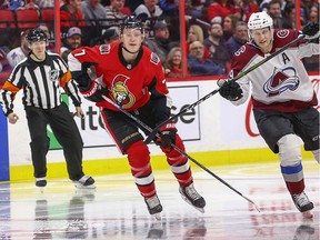 Brady Tkachuk covers Nathan MacKinnon in the second period as the Ottawa Senators take on the Colorado Avalanche in NHL action at the Canadian Tire Centre in Ottawa on Thursday, Feb. 6, 2020.