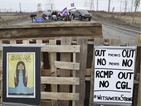 Native protestors block two ends of Hwy. 6 in Caledonia on Tuesday in support of the Wet-suwet'en pipeline dispute and the OPP removal of the blockade in Belleville on Monday.