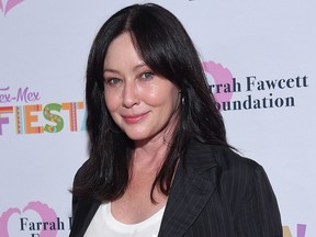 In this file photo, Shannen Doherty walks the carpet at the Farrah Fawcett Foundation's "Tex-Mex Fiesta" honoring Marcia Cross at Wallis Annenberg Center for the Performing Arts in Beverly Hills, California, on Sept. 6, 2019.