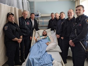 Firefighters reunite with Conrad Williams, who survived an 'extremely complex extrication' from a wrecked car last week.