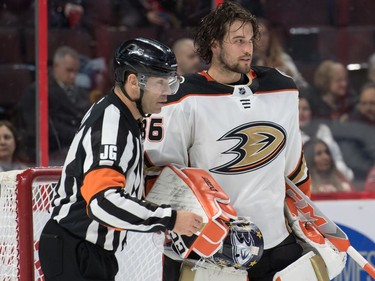 Anaheim Ducks goalie John Gibson is forced to change masks after stopping a shot from Ottawa Senators center Jean-Gabriel Pageau (not pictured) in the second period at the Canadian Tire Centre.