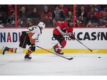 Ottawa Senators left wing Anthony Duclair (right) shoots the puck away from Anaheim Ducks right wing Ondrej Kase in the first period at the Canadian Tire Centre on Tuesday.