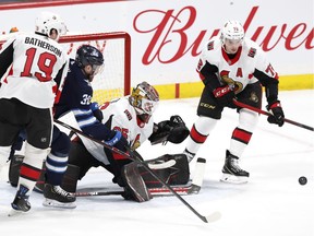 Winnipeg Jets right wing Logan Shaw looks for a rebound after a save by Ottawa Senators goaltender Marcus Hogberg at Bell MTS Place on Saturday.