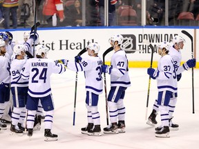 Leafs players celebrate their win over Florida in Sunrise, Fla., on Thursday. Toronto hosts Vancouver on Saturday. (USA TODAY SPORTS)