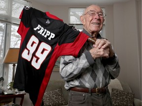 A group of old sports gathered recently to give Johnny Fripp a special Redblacks jersey emblazoned with his name and 99 on the back.